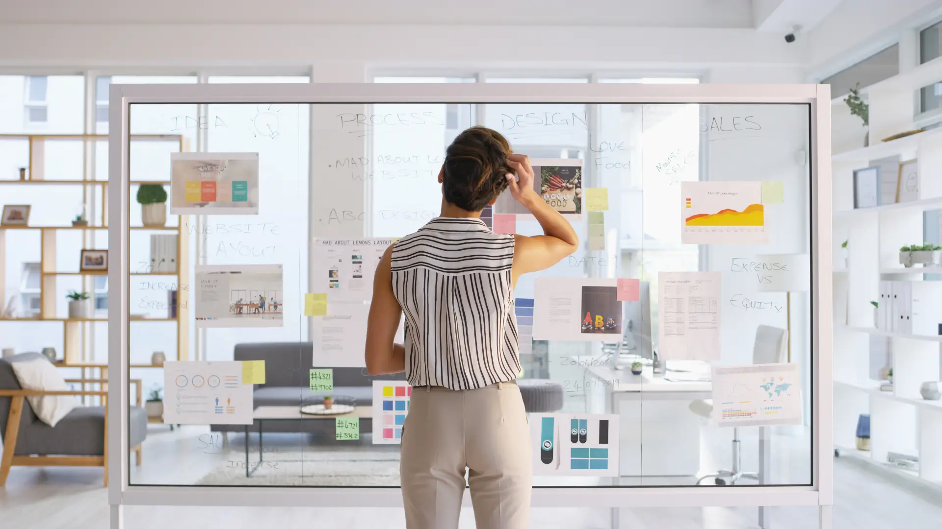 Woman standing in front of whiteboard