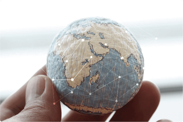 Globe held between fingers